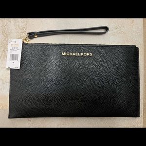 Brand new Michael Kors black leather wristlet